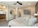 Serene bedroom with ensuite bathroom featuring luxurious finishes, art, and contemporary fixtures at 11623 W Marguerite Ave, Avondale, AZ 85323