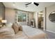 Bright primary bedroom with large window view, ensuite bathroom, and neutral color palette at 11623 W Marguerite Ave, Avondale, AZ 85323