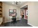 Home office features a modern workspace and views into kitchen, complete with neutral paint at 11623 W Marguerite Ave, Avondale, AZ 85323