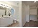 Bright bathroom featuring a step-in shower, wood-look flooring, and a contemporary vanity with marble countertop at 1179 N 13Th St, Coolidge, AZ 85128
