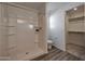 Clean bathroom featuring walk-in shower, modern toilet, and functional design, leading to walk-in closet at 1179 N 13Th St, Coolidge, AZ 85128
