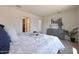 Bedroom with plush bedding, side tables, carpeted floors, art, and bright natural light at 1179 N 13Th St, Coolidge, AZ 85128