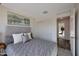 Inviting bedroom features a padded headboard, sliding door closet, and an open doorway to the rest of the home at 1179 N 13Th St, Coolidge, AZ 85128