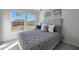 Bright bedroom featuring two windows offering natural light, and a padded headboard for maximum comfort at 1179 N 13Th St, Coolidge, AZ 85128