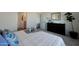 Comfortable bedroom featuring neutral walls, carpet, and decor, leading to bathroom with granite counters at 1179 N 13Th St, Coolidge, AZ 85128
