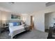 Cozy bedroom featuring neutral carpet, a comfortable upholstered bed, and a serene, spa-like atmosphere at 1179 N 13Th St, Coolidge, AZ 85128