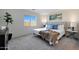 Bright bedroom filled with natural light, showcasing a comfortable bed, neutral decor, and a calm, airy ambiance at 1179 N 13Th St, Coolidge, AZ 85128