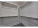Large, organized walk-in closet with ample shelving and hanging space, providing a functional and tidy storage solution at 1179 N 13Th St, Coolidge, AZ 85128
