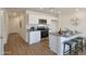 Charming kitchen features stainless steel appliances, granite countertops, and a breakfast bar with stool seating at 1179 N 13Th St, Coolidge, AZ 85128