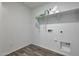 Empty laundry room with shelving, washer and dryer hookups, and modern flooring at 1179 N 13Th St, Coolidge, AZ 85128