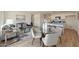 Open-concept living space featuring modern kitchen with island, dining area, and stylish furniture at 1179 N 13Th St, Coolidge, AZ 85128
