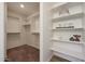 Spacious walk-in closet with built-in shelving and clothing rods for ample storage and organization at 1179 N 13Th St, Coolidge, AZ 85128