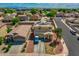 Aerial view of a two story home with a detached garage, solar panels and desert landscaping at 13171 W Redfield Rd, Surprise, AZ 85379