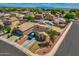 Expansive aerial view of a two-story home with solar panels and a well-kept front yard in a suburban neighborhood at 13171 W Redfield Rd, Surprise, AZ 85379