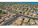 Aerial view of neighborhood streets, homes with tile roofs, and desert landscaping at 13171 W Redfield Rd, Surprise, AZ 85379