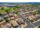 An aerial shot of a neighborhood with houses, streets, trees, and desert landscape at 13171 W Redfield Rd, Surprise, AZ 85379