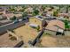 Aerial view of spacious backyard with covered patio, surrounded by a block fence and nearby homes at 13171 W Redfield Rd, Surprise, AZ 85379