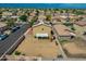 Expansive backyard featuring a covered patio, surrounded by block fence and neighboring houses at 13171 W Redfield Rd, Surprise, AZ 85379
