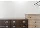 Bedroom showcasing a wooden dresser with metal handles against a white wall at 13171 W Redfield Rd, Surprise, AZ 85379