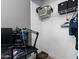 A closet with shelving and storage, containing items like a laundry basket, clothing, and gaming equipment at 13171 W Redfield Rd, Surprise, AZ 85379