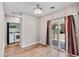 Open living space including laundry room and sliding glass doors leading to outdoor patio at 13171 W Redfield Rd, Surprise, AZ 85379