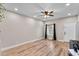 Open concept living room with wood floors, bright light and neutral walls at 13171 W Redfield Rd, Surprise, AZ 85379