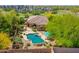 An aerial view reveals a private backyard oasis with a sparkling pool and meticulously landscaped surroundings at 15216 W Westview Dr, Goodyear, AZ 85395