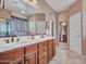 This bathroom offers a dual sink vanity and a framed mirror at 15216 W Westview Dr, Goodyear, AZ 85395