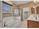 This bathroom features a separate tub and shower with a glass enclosure at 15216 W Westview Dr, Goodyear, AZ 85395