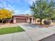 Charming single-story home features a well-manicured front yard and a two-car garage at 15216 W Westview Dr, Goodyear, AZ 85395
