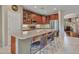 Modern kitchen features an island with seating, stainless steel appliances, and ample counter space at 15216 W Westview Dr, Goodyear, AZ 85395