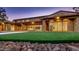 Luxurious backyard featuring a large patio and lawn area, providing seamless indoor-outdoor living at 15217 N 15Th Dr, Phoenix, AZ 85023