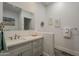 Bathroom with double sink, quartz countertops, and recessed lighting creates a spa-like retreat at 15217 N 15Th Dr, Phoenix, AZ 85023