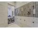 The luxurious shower with multiple shower heads also features views of the jacuzzi style tub and vanity at 15217 N 15Th Dr, Phoenix, AZ 85023
