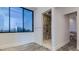 The tiled bathroom offers a large window for lots of light and showcases the large walk in shower at 15217 N 15Th Dr, Phoenix, AZ 85023