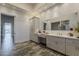 The primary bathroom boasts dual sinks, vanity, and a view to the outside at 15217 N 15Th Dr, Phoenix, AZ 85023