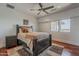 Bright bedroom features a modern ceiling fan, recessed lighting, and a large window offering plenty of natural light at 15217 N 15Th Dr, Phoenix, AZ 85023