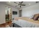 A bedroom that features modern lighting and a doorway to a bathroom and walk in closet at 15217 N 15Th Dr, Phoenix, AZ 85023