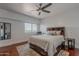 Bright bedroom features natural lighting, a bed with storage underneath, and modern furnishing at 15217 N 15Th Dr, Phoenix, AZ 85023