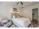Bright bedroom with white walls, dark wood floors, and seating area at 15217 N 15Th Dr, Phoenix, AZ 85023