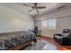 Bright bedroom featuring hardwood floors, a ceiling fan, natural light, and city views at 15217 N 15Th Dr, Phoenix, AZ 85023