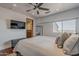 Bedroom features an ensuite bathroom, a large window with a view, and modern decor at 15217 N 15Th Dr, Phoenix, AZ 85023