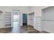 A well-organized walk-in closet offers ample storage with built-in shelving and modern design at 15217 N 15Th Dr, Phoenix, AZ 85023