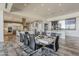 Dining room with access to the kitchen and island with seating for three at 15217 N 15Th Dr, Phoenix, AZ 85023