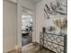Contemporary entryway shows open doorway to workout room and modern console table at 15217 N 15Th Dr, Phoenix, AZ 85023
