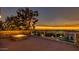 Beautiful rooftop fire pit area with sunset views and stainless steel cable railing, perfect for entertaining guests at 15217 N 15Th Dr, Phoenix, AZ 85023