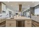 This kitchen features an island, stainless steel appliances, and an open floor plan leading to the living room at 15217 N 15Th Dr, Phoenix, AZ 85023
