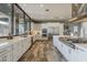 Open kitchen with stainless steel appliances, white cabinets, a huge window with a nice backyard view at 15217 N 15Th Dr, Phoenix, AZ 85023