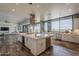 Bright kitchen with large island, stainless steel appliances, with access to the living room and dining area at 15217 N 15Th Dr, Phoenix, AZ 85023