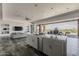 Open concept kitchen and living space with island and view to the backyard at 15217 N 15Th Dr, Phoenix, AZ 85023